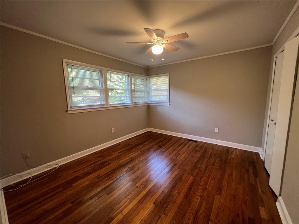 434 Christopher Drive Gainesville, GA 30501 - Photo 6 of 11 a view of an empty room with wooden floor and a window