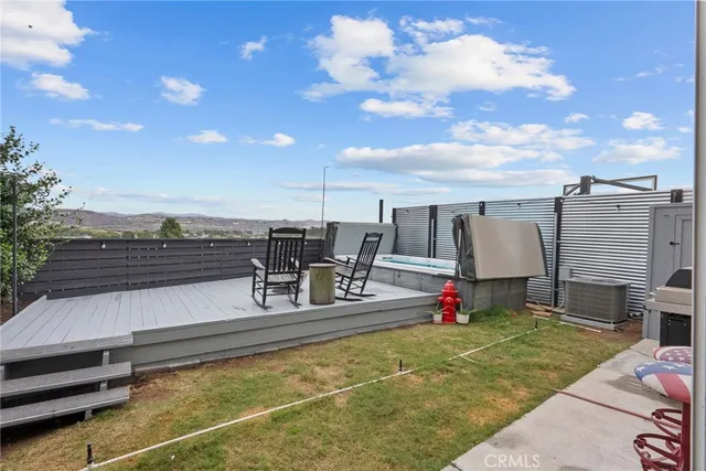a view of swimming pool with seating space and deck