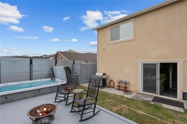 a view of a chair and table in the balcony