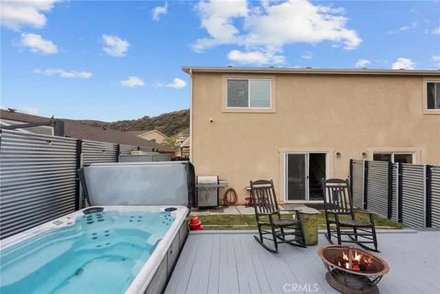 a view of a terrace with furniture and a flat screen tv