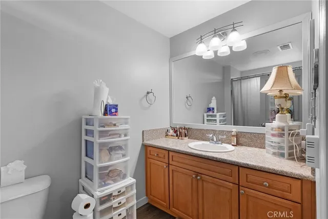 a bathroom with a double vanity sink and a mirror