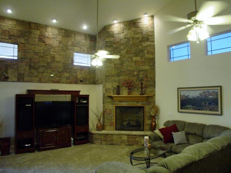 2416 Rodeo Street Selma, CA 93662 - Photo 36 of 99 Floor to ceiling stone fireplace with stone wall facade.
