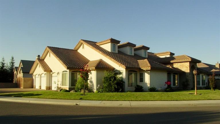 2416 Rodeo Street Selma, CA 93662 - Photo 51 of 99 Corner view of home with stained concrete driveway