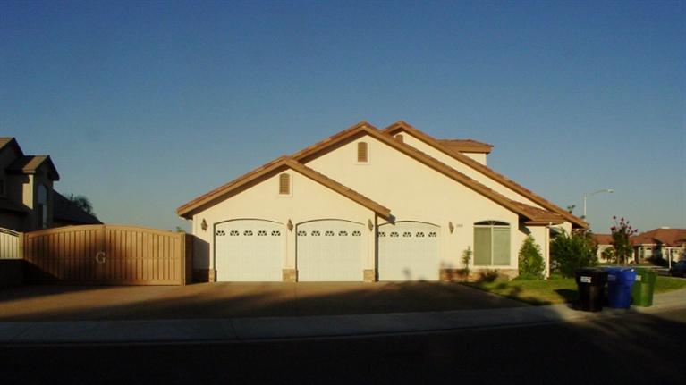 2416 Rodeo Street Selma, CA 93662 - Photo 55 of 99 Oversized 3 car garage w/ 2 bay attic access, compressor room and 20' RV parking w/ electric hookups