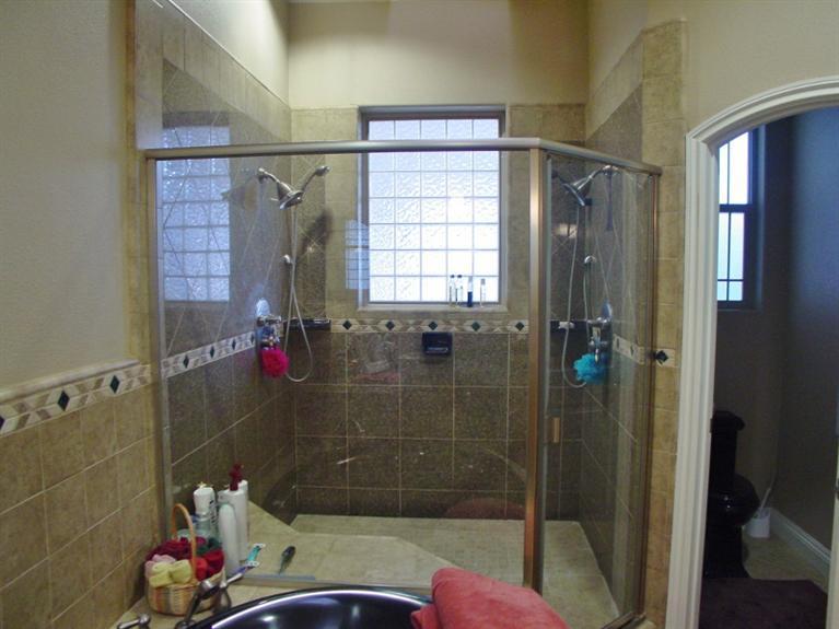 2416 Rodeo Street Selma, CA 93662 - Photo 63 of 99 Large master shower with two shower heads and wall jets.