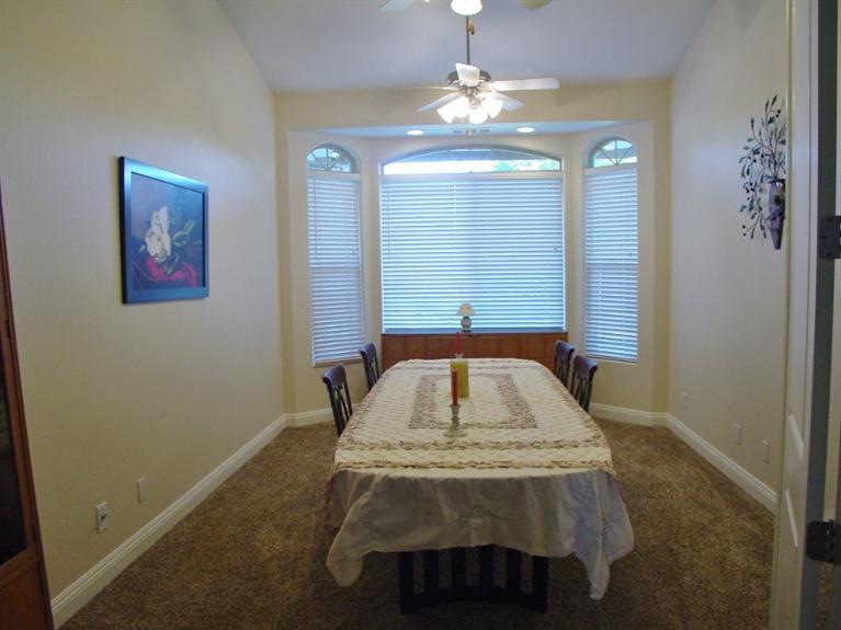 2416 Rodeo Street Selma, CA 93662 - Photo 66 of 99 Large dinning room with bay windows, vaulted ceiling and 2 fans
