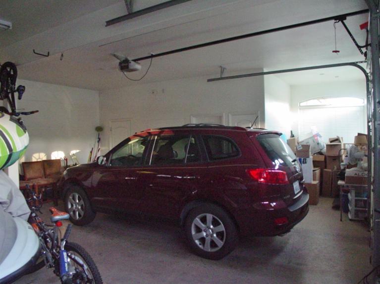 2416 Rodeo Street Selma, CA 93662 - Photo 95 of 99 3 car garage with storage area, compressor room and storage room