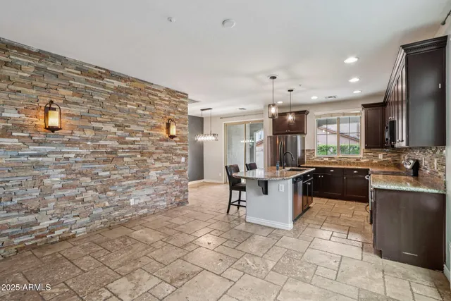 a stove top oven sitting inside of a kitchen