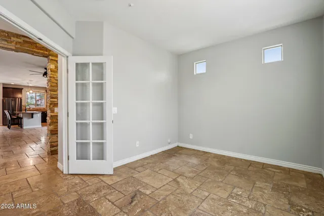 a view of an empty room and fire place