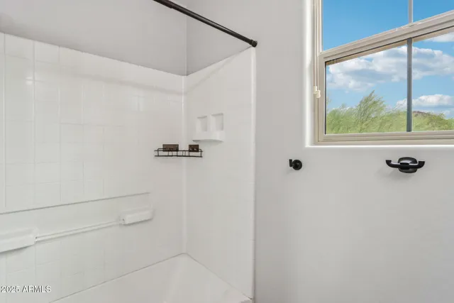 a utility room with sink dryer and washer