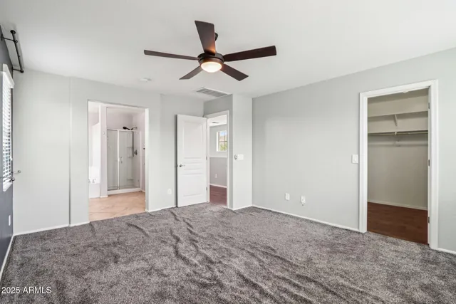 a spacious bathroom with a tub sink mirror and shower