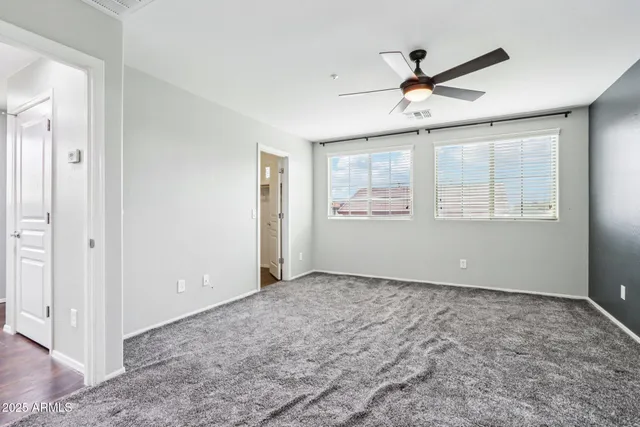 a bathroom with a bathtub a shower and a window