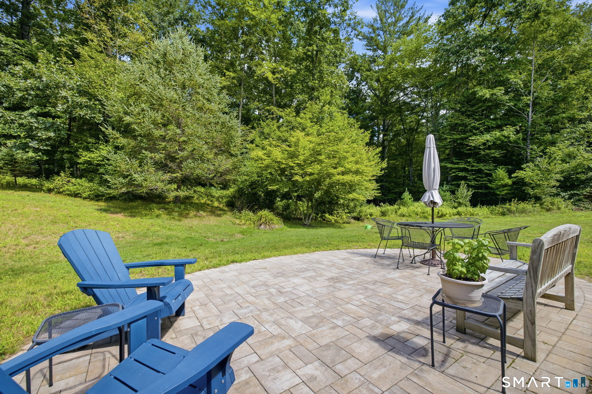 24 Liska Road Willington, CT 06279 - Photo 29 of 40 The stone patio in the private back yard extends your entertaining area for dining and relaxing.
