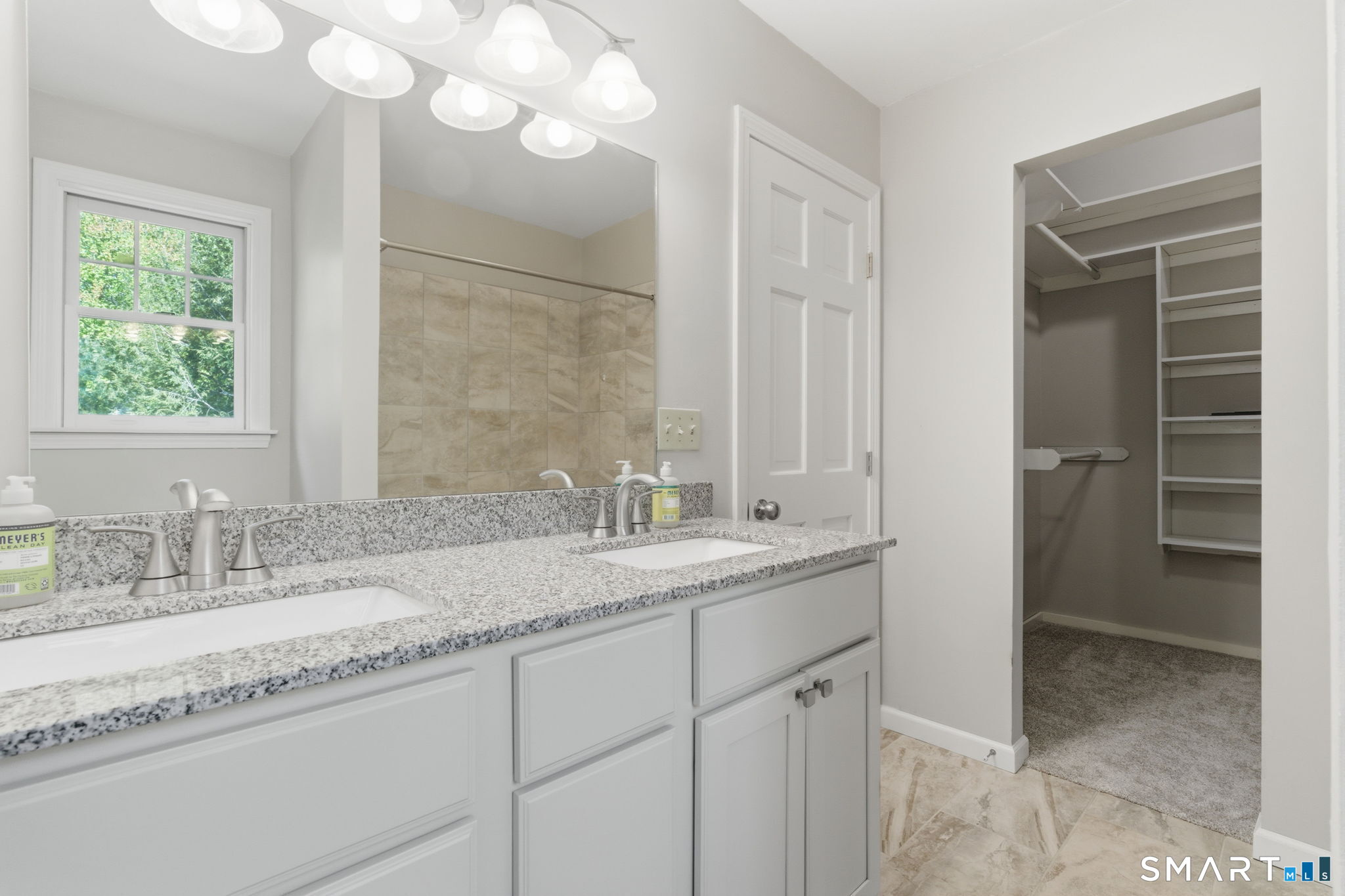21 Greenwood Road North Granby, CT 06060 - Photo 25 of 40 a bathroom with a granite countertop sink a mirror and a shower