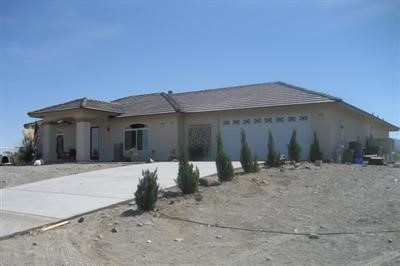 11471 Golden View Road Pinon Hills, CA 92372 - Photo 1 of 1 a front view of a house with a yard