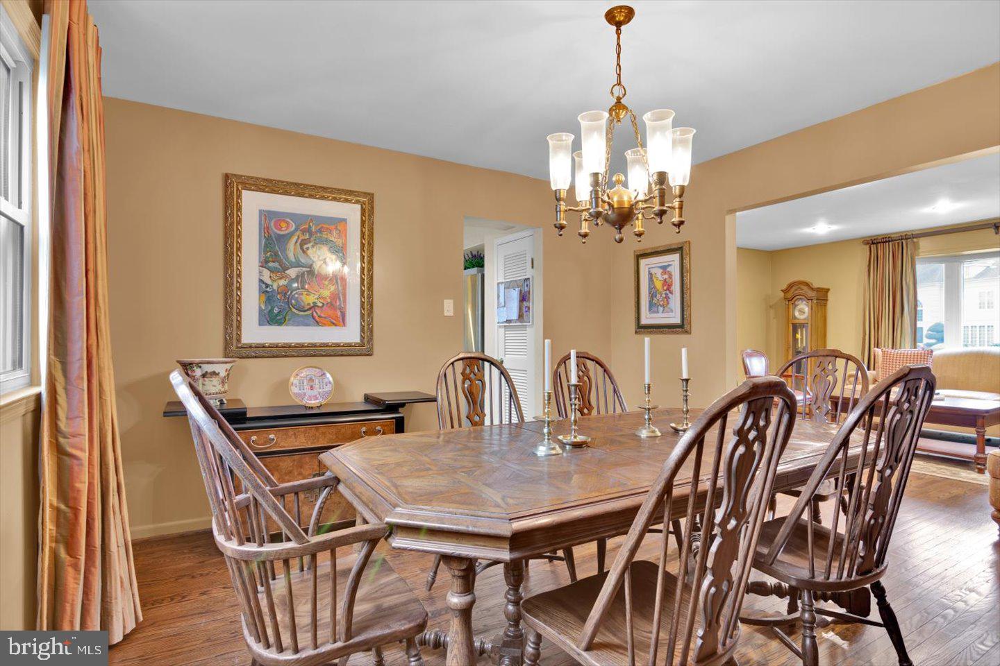 123 Hart Road Cherry Hill, NJ 08034 - Photo 16 of 57 a dining room with furniture a chandelier and wooden floor