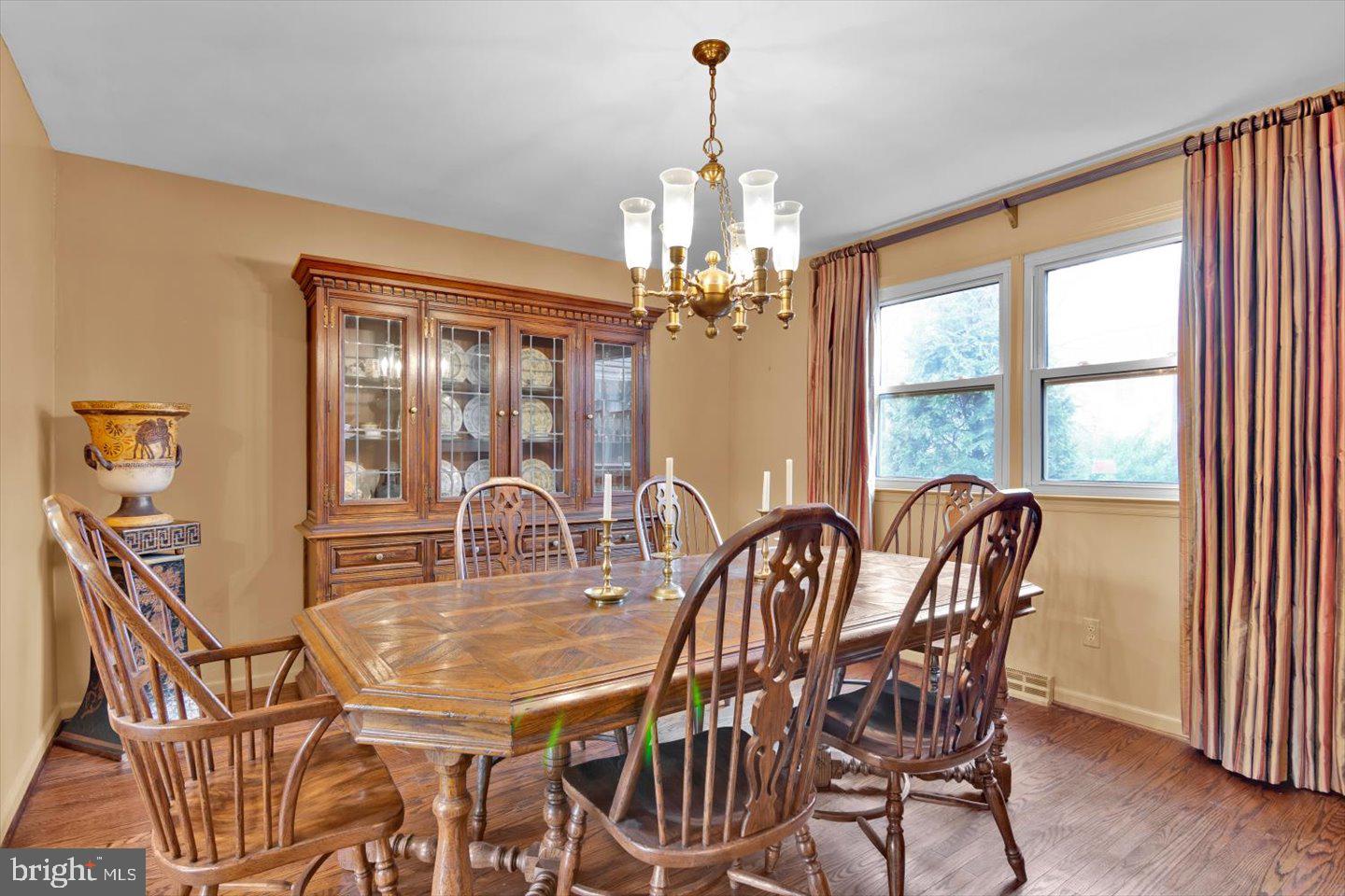 123 Hart Road Cherry Hill, NJ 08034 - Photo 17 of 57 a dining room with furniture a chandelier and wooden floor