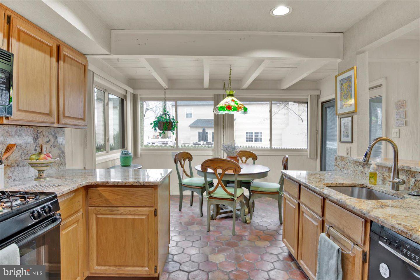 123 Hart Road Cherry Hill, NJ 08034 - Photo 23 of 57 a kitchen with granite countertop a sink and a stove top oven