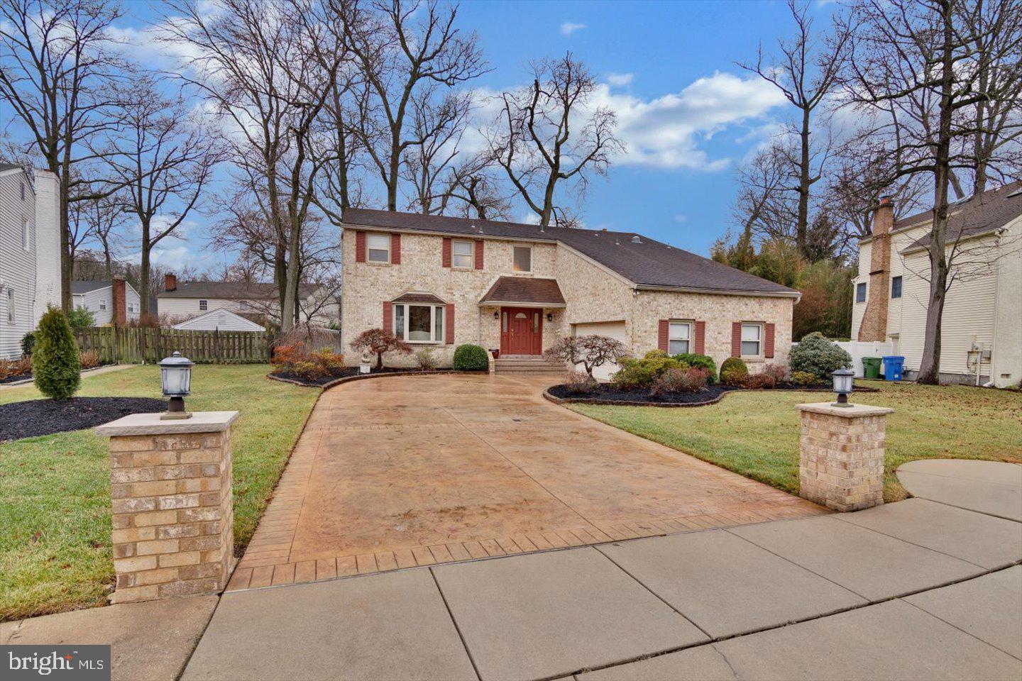 123 Hart Road Cherry Hill, NJ 08034 - Photo 3 of 57 a front view of a house with a yard and trees