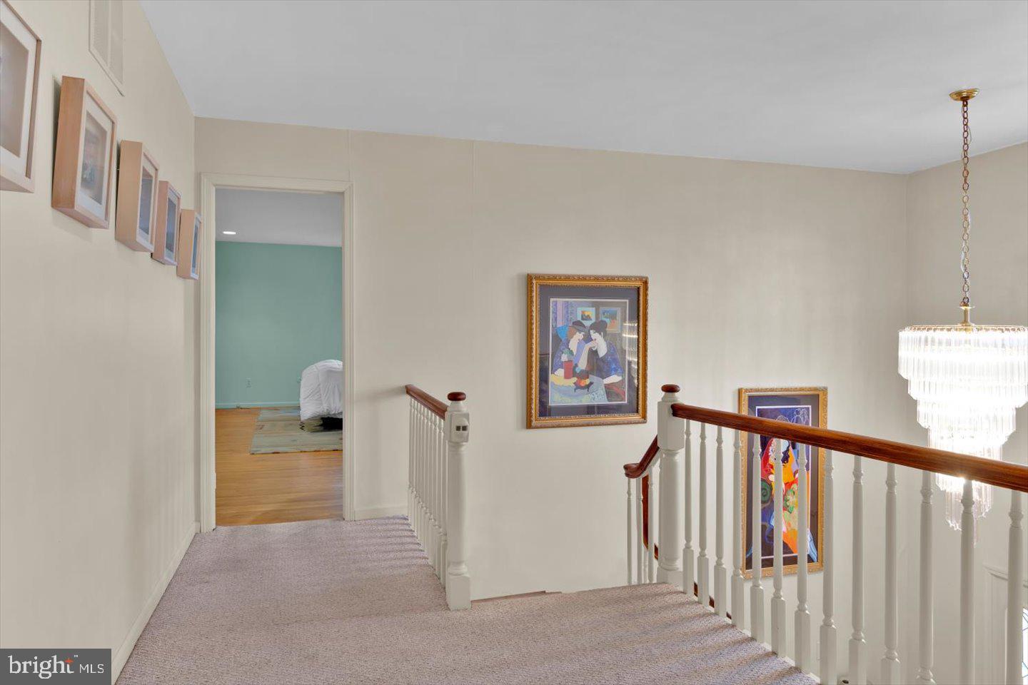 123 Hart Road Cherry Hill, NJ 08034 - Photo 36 of 57 a view of a hallway with paintings on the wall