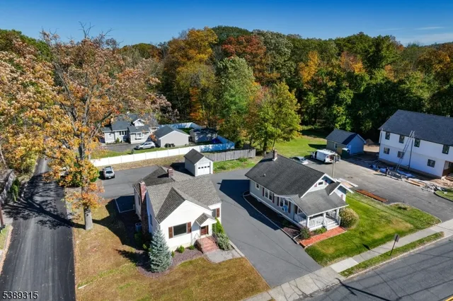 a view of house with outdoor space and sitting area