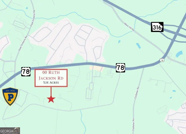 a street sign on a wall next to a road