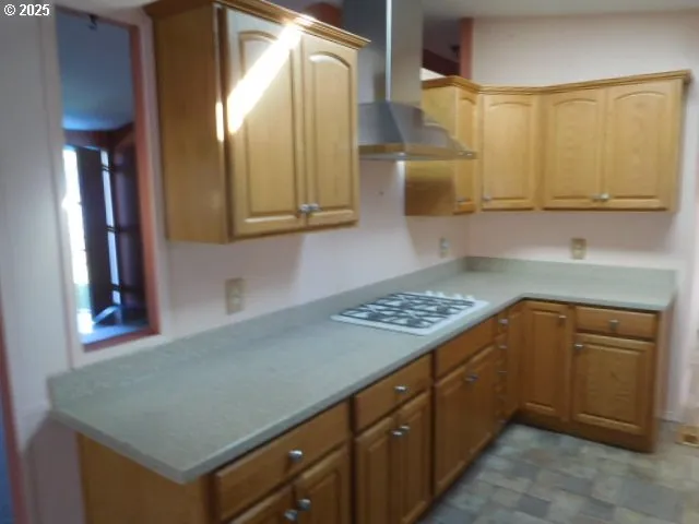 a kitchen with cabinets and appliances