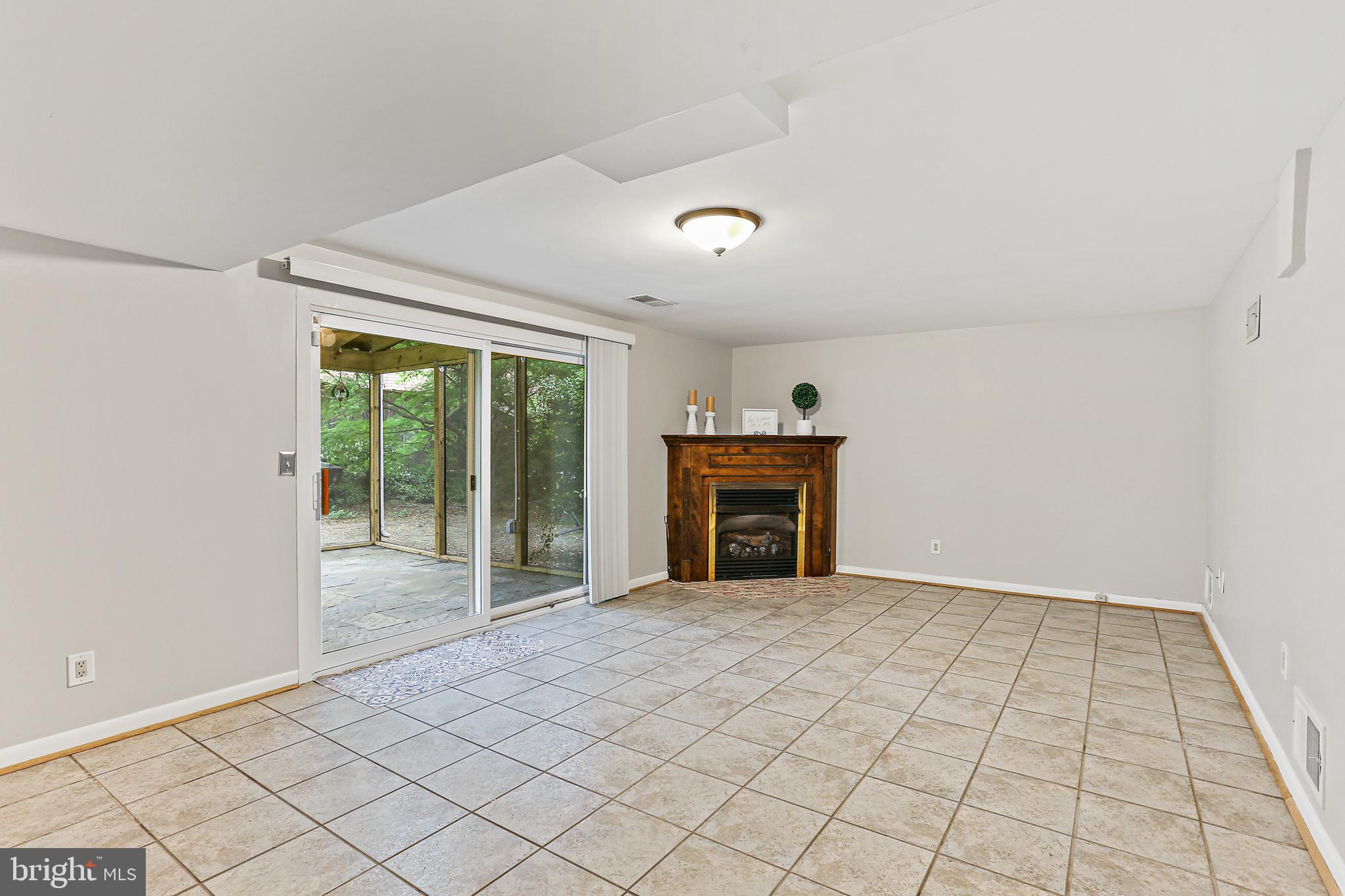 403 Eisner Street Silver Spring, MD 20901 - Photo 28 of 36 Lower Level Leading to Screened-in Porch