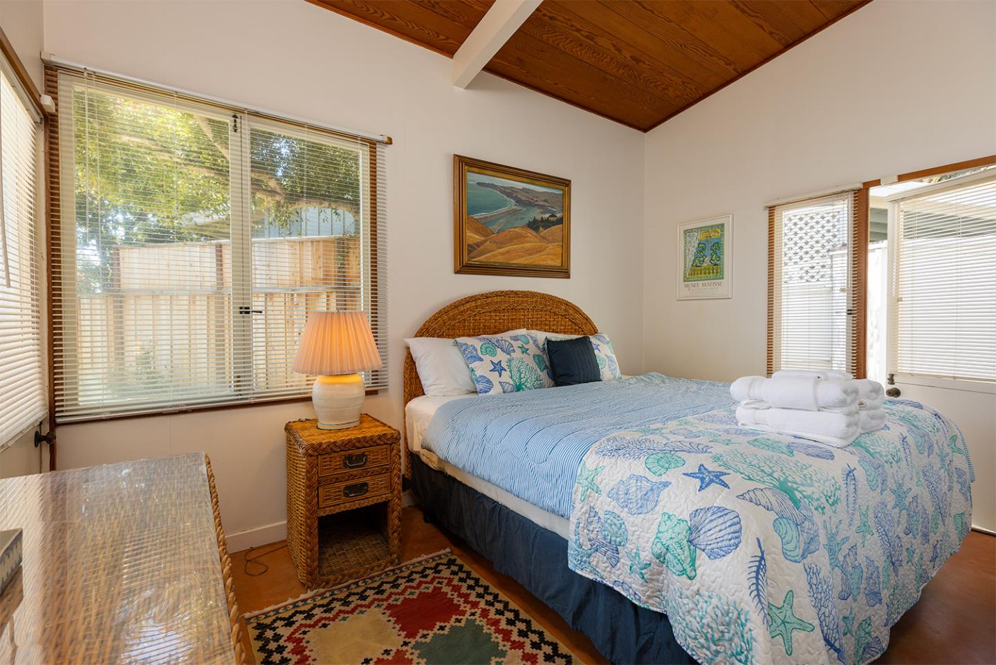 739 Las Olas Drive Aptos, CA 95003 - Photo 17 of 31 a bedroom with a bed lamp and a window
