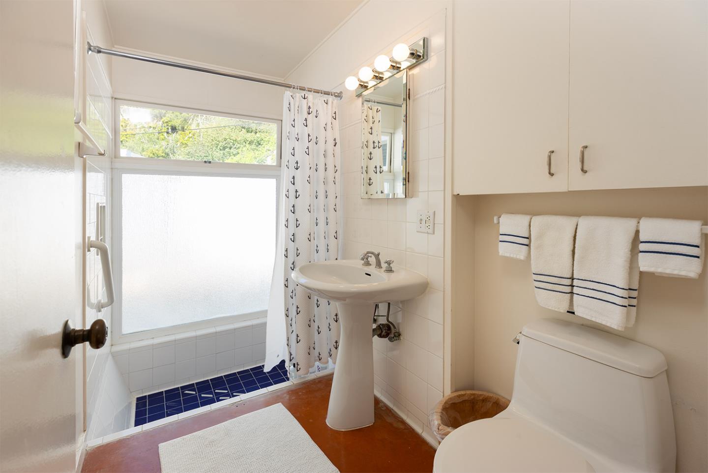 739 Las Olas Drive Aptos, CA 95003 - Photo 20 of 31 a bathroom with a sink toilet and shower