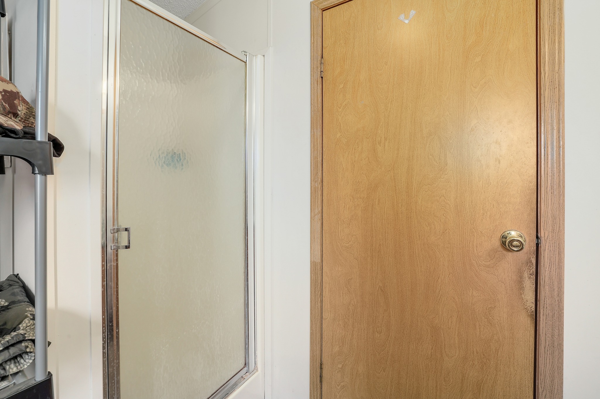 288 The Forest Road Dale, TX 78616 - Photo 15 of 31 a bathroom with a glass shower door