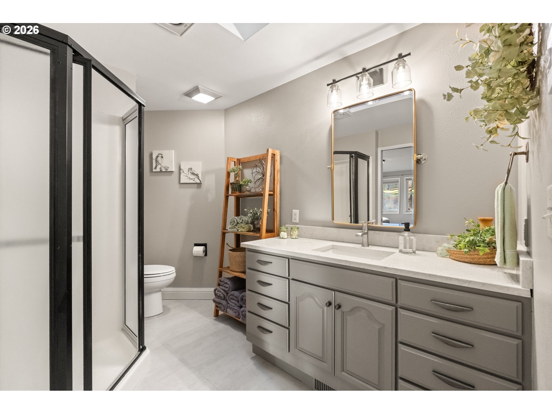 91448 Steinmetz Road Junction City, OR 97448 - Photo 29 of 48 a spacious bathroom with a granite countertop sink mirror and toilet