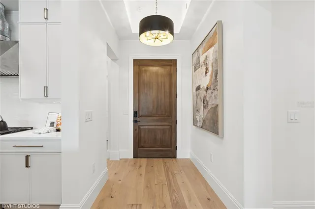 a bathroom with a sink vanity mirror and toilet