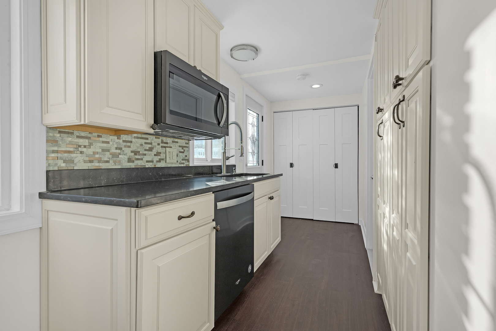 3225 Illinois Road Wilmette, IL 60091 - Photo 11 of 22 a kitchen with stainless steel appliances granite countertop a sink and a refrigerator