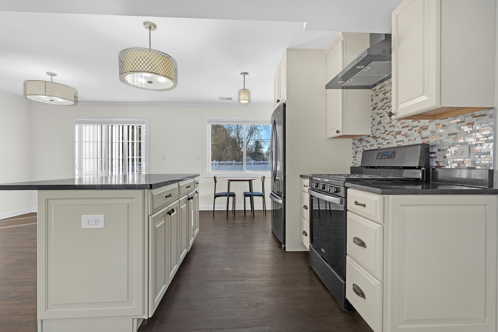3225 Illinois Road Wilmette, IL 60091 - Photo 12 of 22 a kitchen with stainless steel appliances granite countertop a stove a sink and a refrigerator