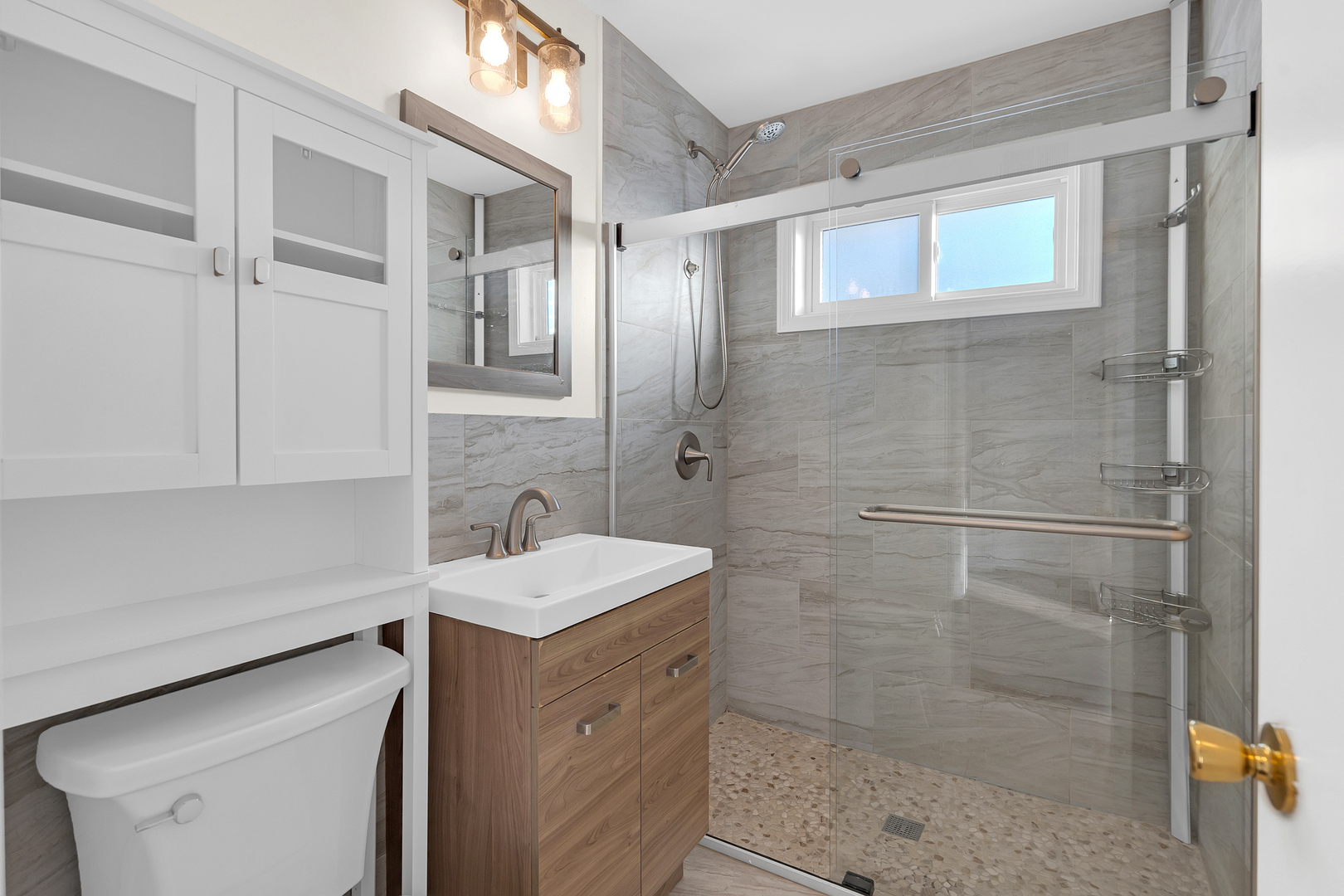 3225 Illinois Road Wilmette, IL 60091 - Photo 16 of 22 a bathroom with a sink and a mirror