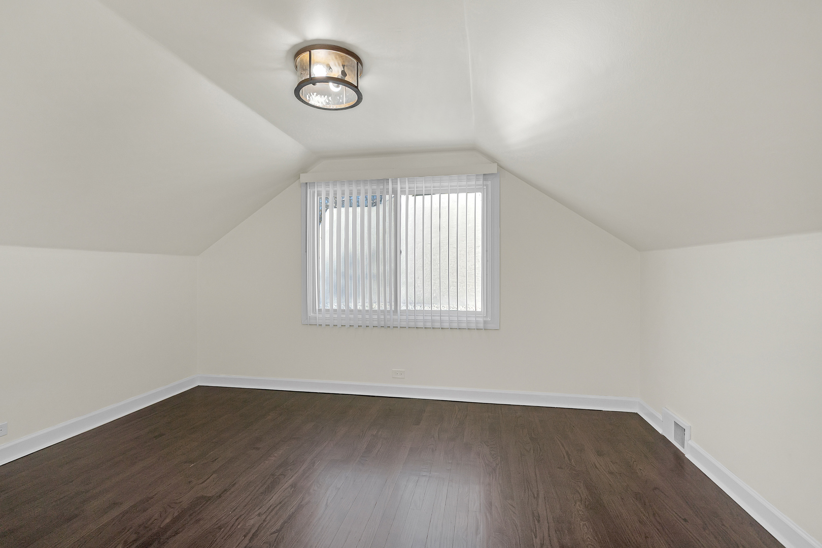 3225 Illinois Road Wilmette, IL 60091 - Photo 19 of 22 an empty room with wooden floor and windows