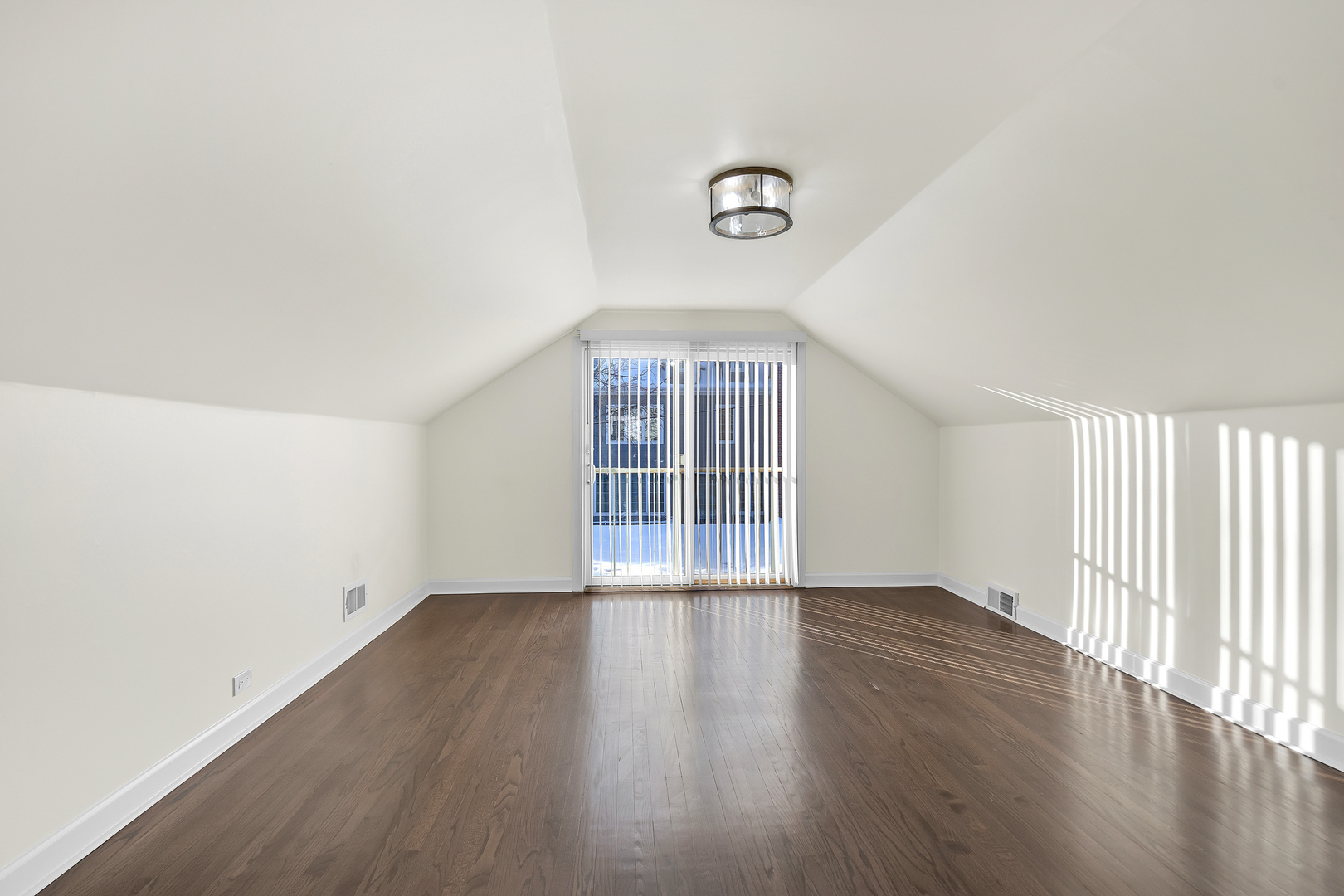 3225 Illinois Road Wilmette, IL 60091 - Photo 20 of 22 an empty room with wooden floor and windows