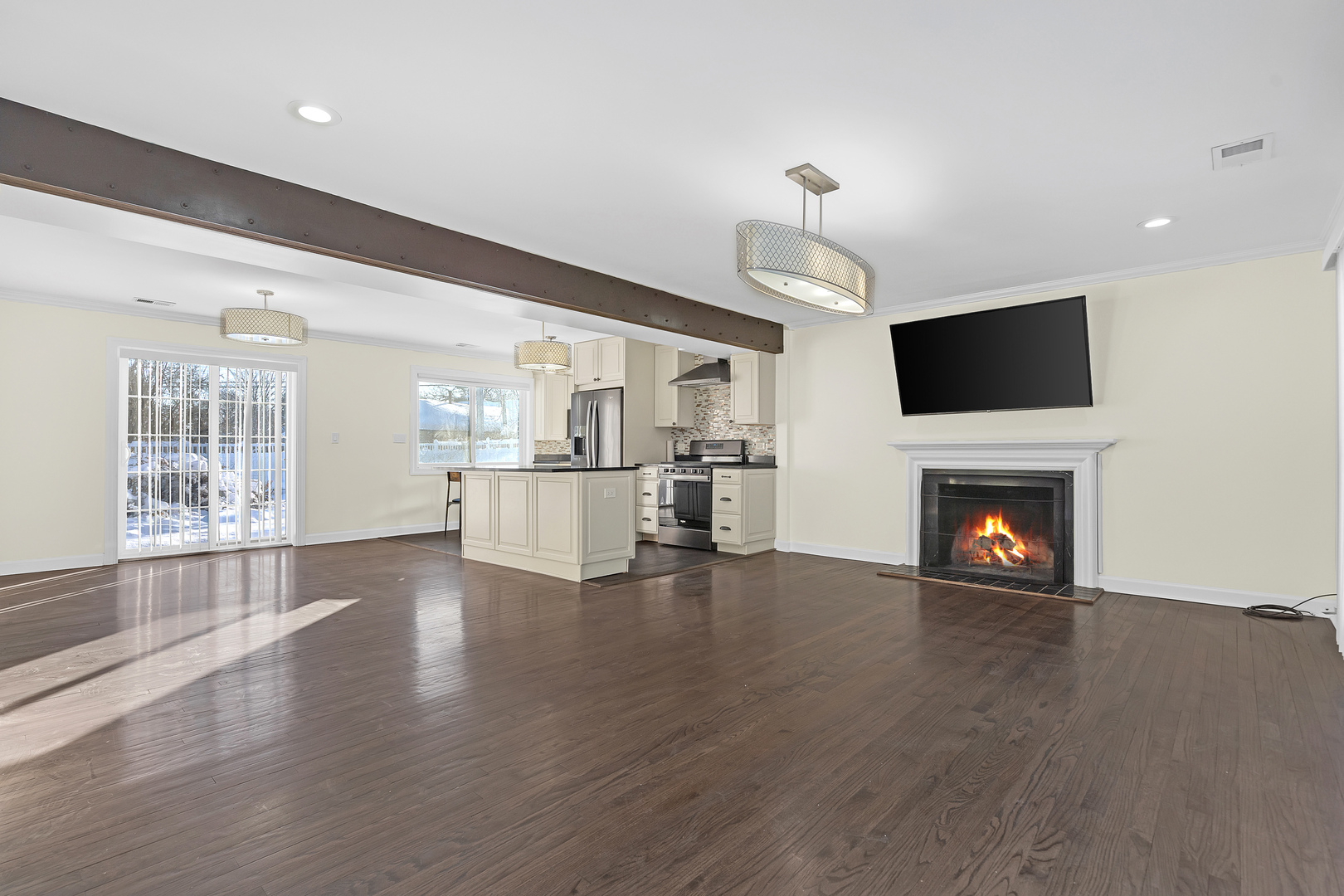 3225 Illinois Road Wilmette, IL 60091 - Photo 4 of 22 a view of a livingroom with wooden floor and a fireplace