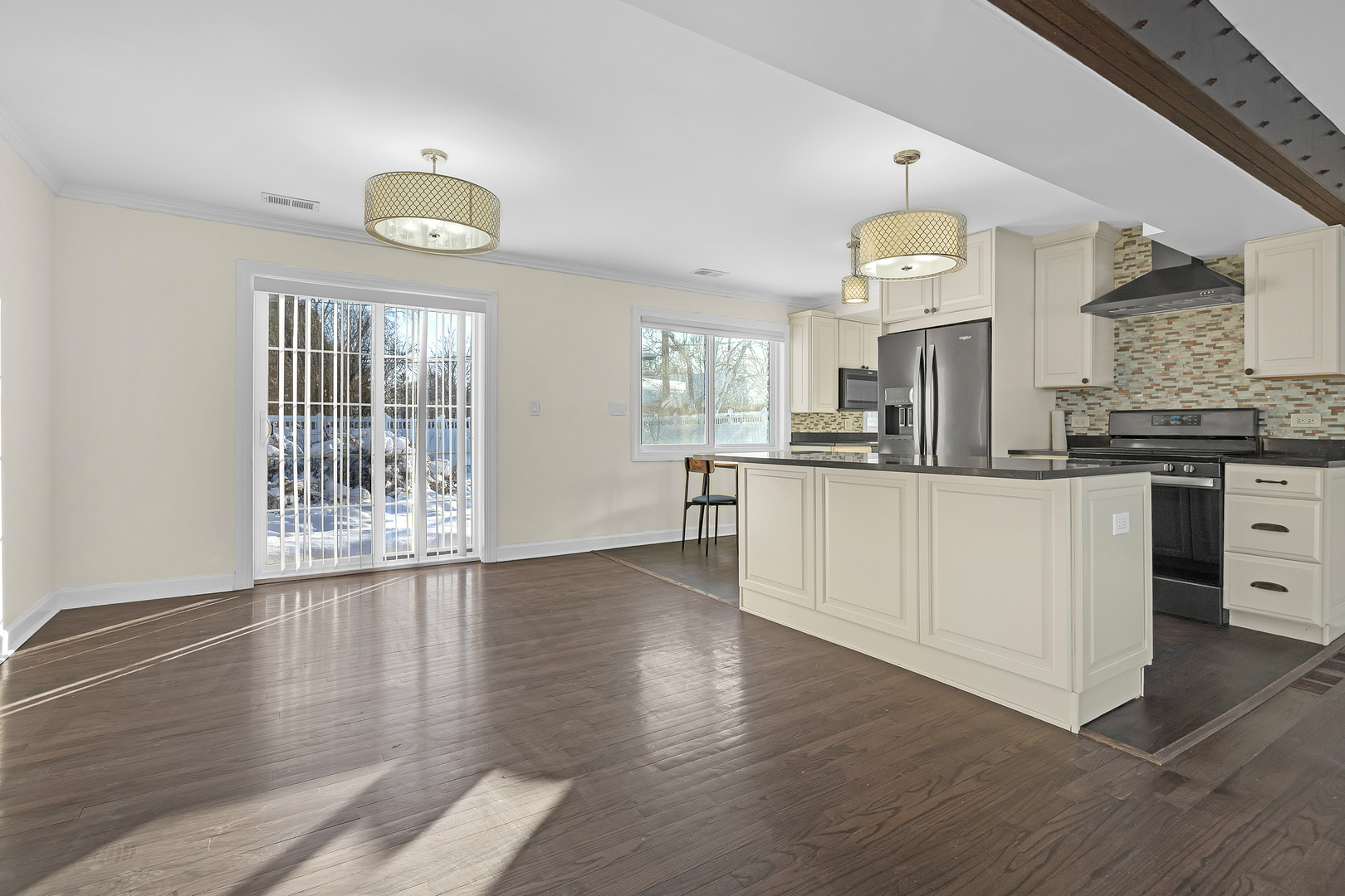 3225 Illinois Road Wilmette, IL 60091 - Photo 9 of 22 a kitchen with stainless steel appliances a stove top oven and cabinets