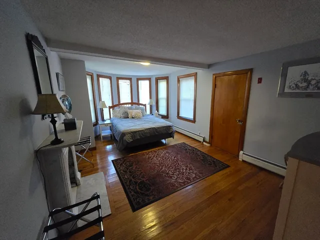 a living room with furniture rug and a window