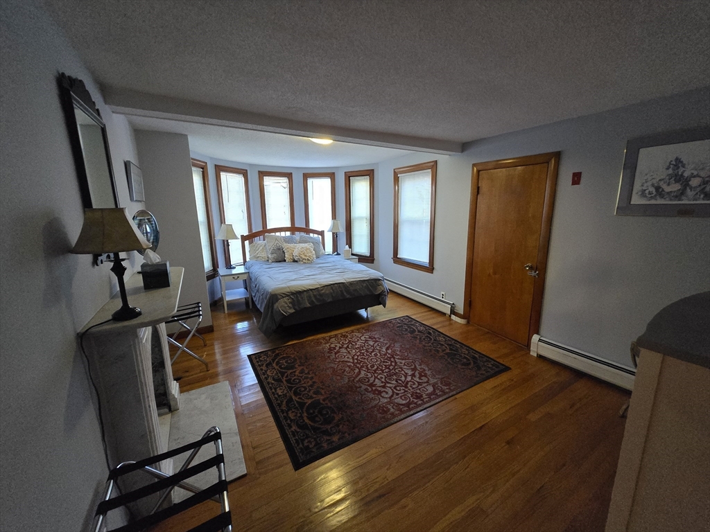 14 Parsons Street, Unit 2 Northampton, MA 01060 - Photo 11 of 28 a living room with furniture rug and a window
