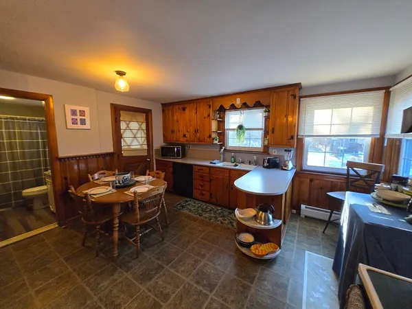 a living room with lots of furniture and a flat screen tv