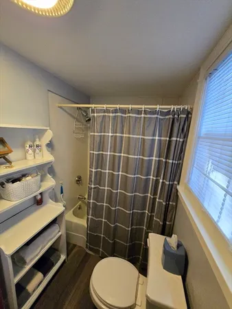 a view of a hallway with seating area