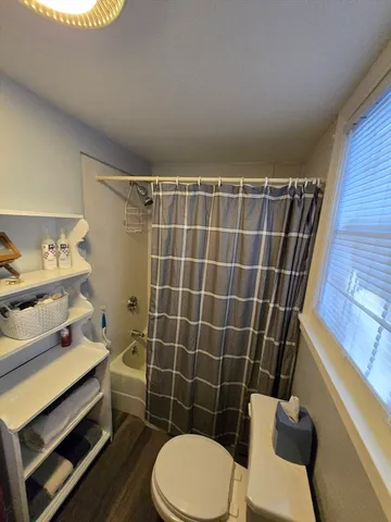 a view of a hallway with seating area