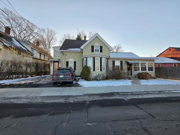 a front view of a house with a yard