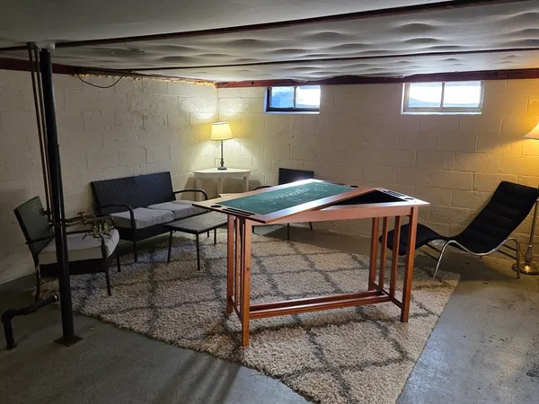 a living room with furniture and a rug