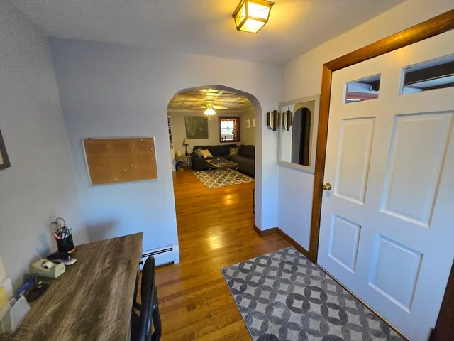 a living room with furniture and a rug