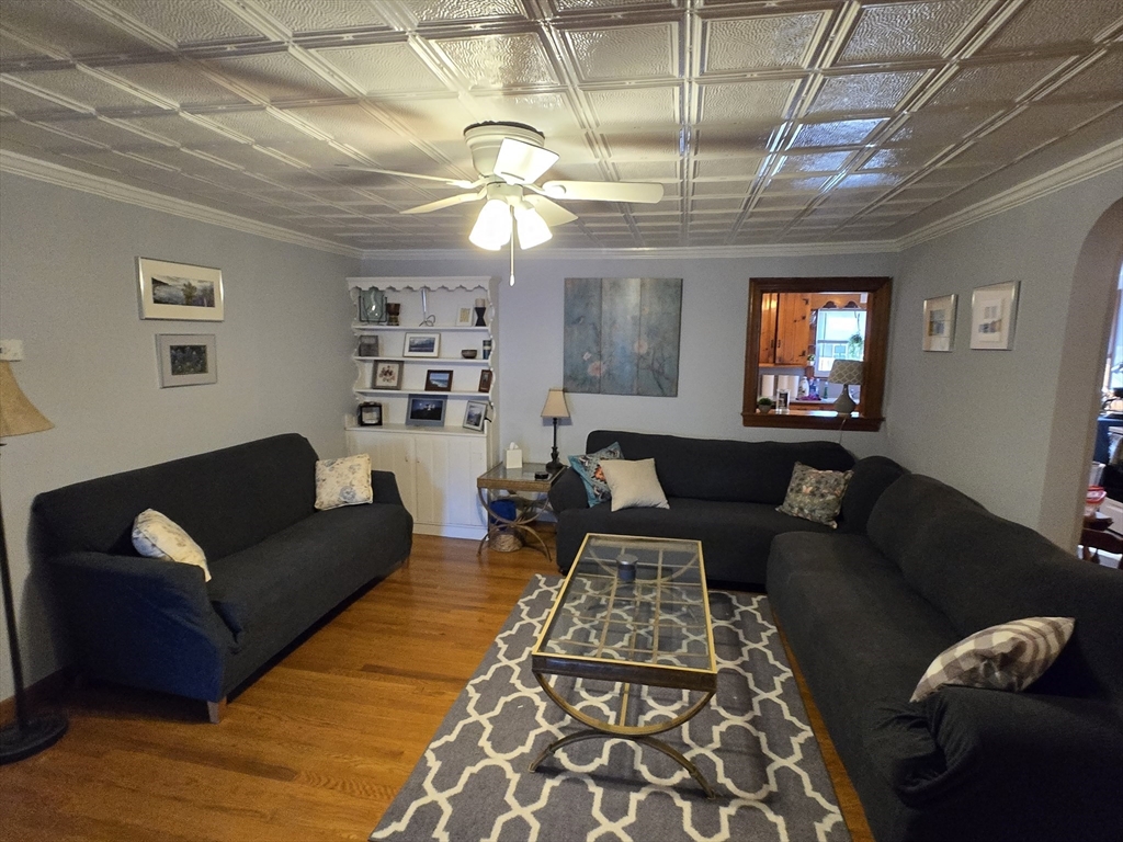 14 Parsons Street, Unit 2 Northampton, MA 01060 - Photo 7 of 28 a living room with furniture and a chandelier