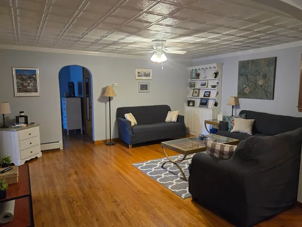 a living room with furniture and a window